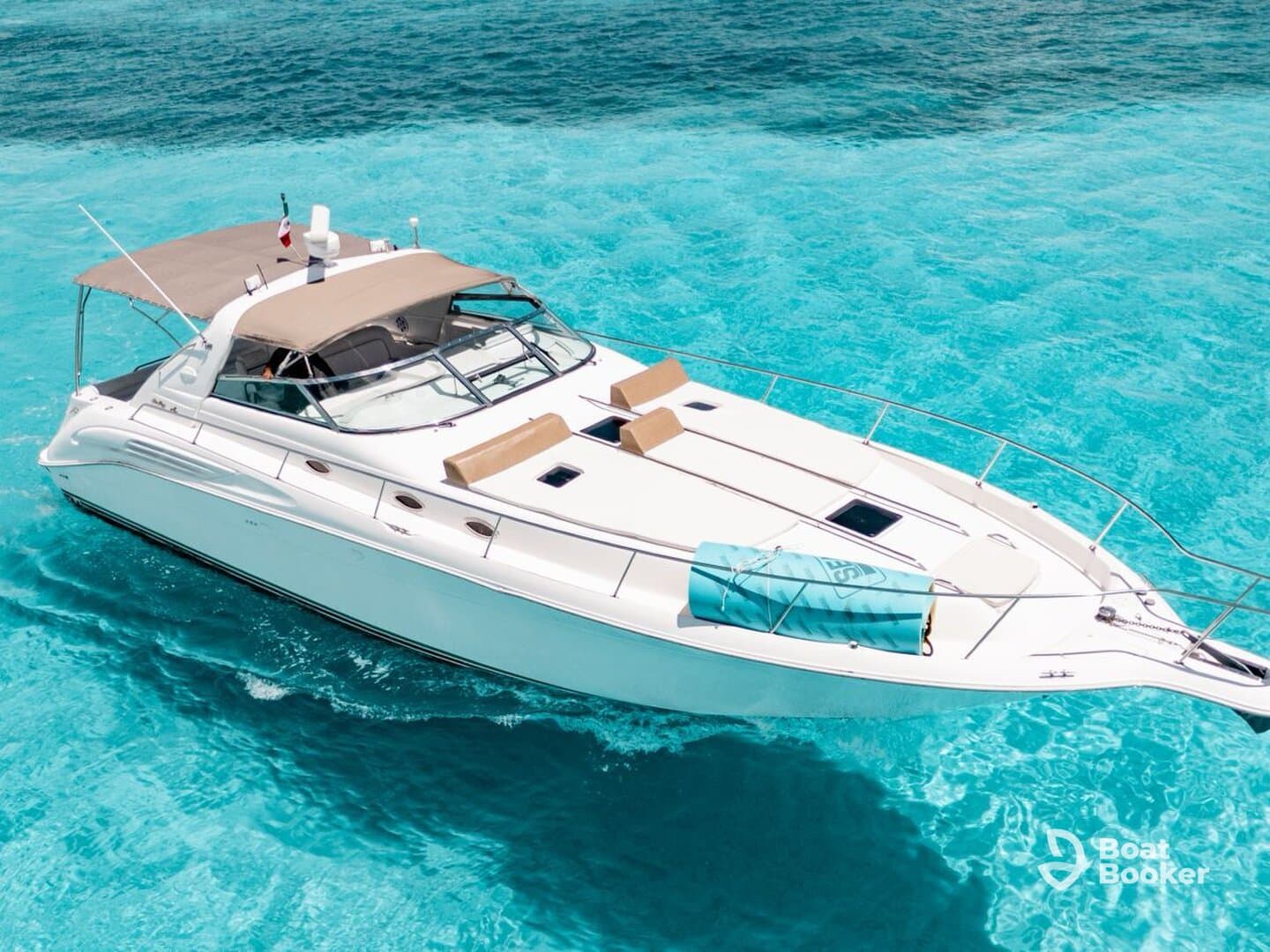 A stunning aerial view of a sleek yacht cruising through crystal-clear turquoise waters, perfect for luxury charters and island adventures.