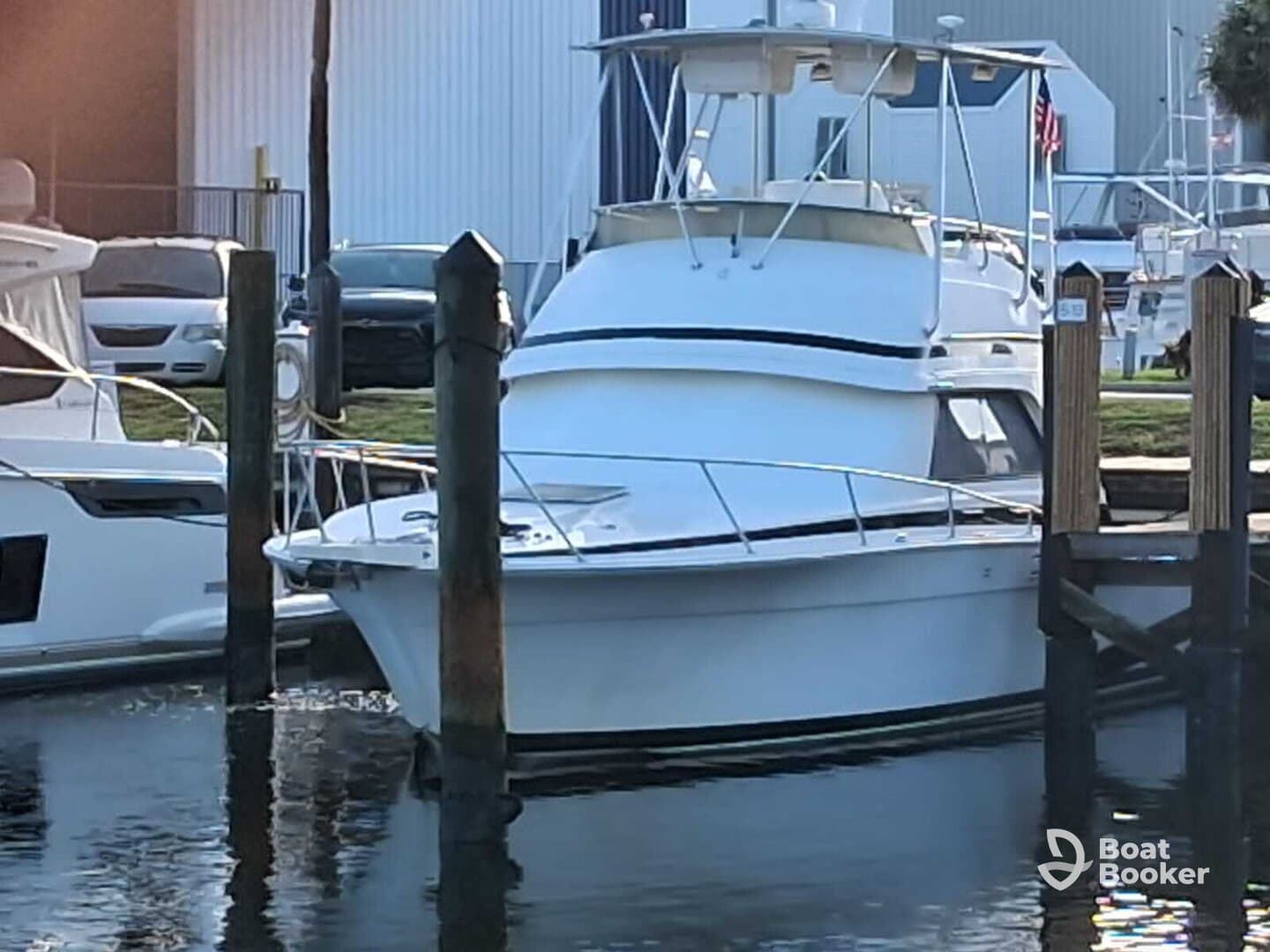 A sleek yacht docked at the marina, showcasing its elegant design and structure, perfect for luxury outings on the water.