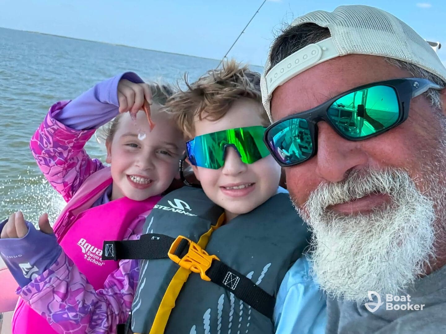 A joyful moment captured with a family on a boat, showcasing kids having fun while fishing — perfect for family adventures on the water.