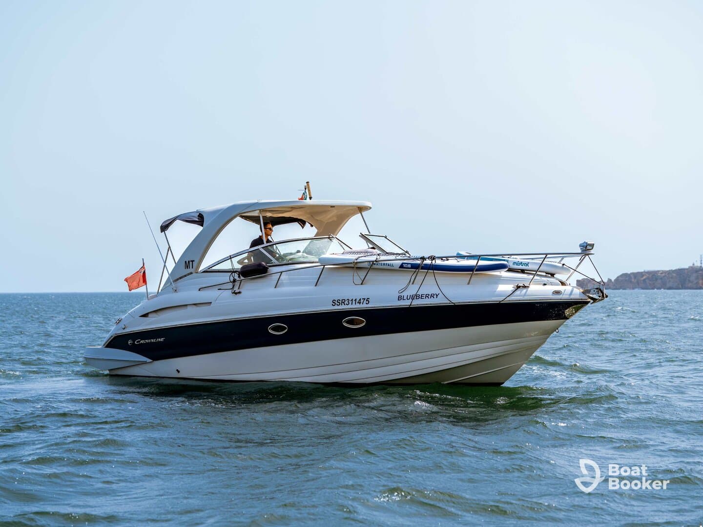 A sleek speedboat named 'Blueberry' navigates the open waters, showcasing its elegant design and perfect for thrilling adventures on the sea.