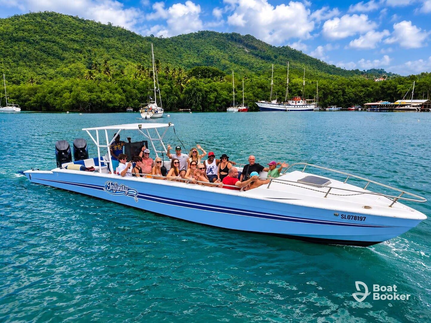 A lively group enjoys a day out on the water aboard a speedboat, showcasing the fun and excitement of a boat trip in a beautiful tropical setting.