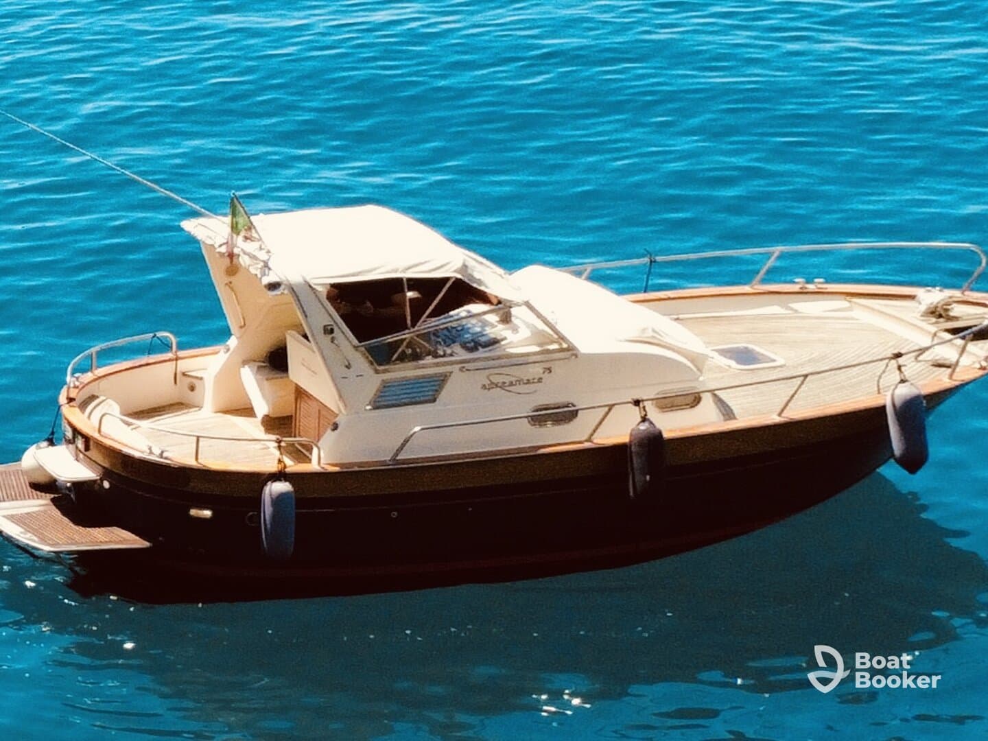 A beautiful yacht anchored in clear blue waters, showcasing its elegant design and inviting atmosphere for a perfect day on the water.