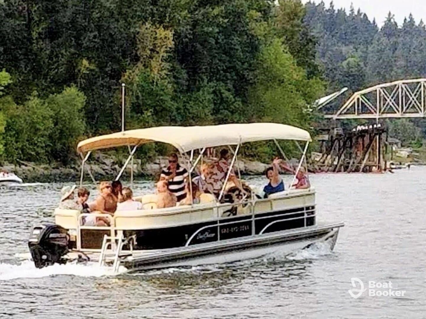A lively group enjoys a day on the water aboard a pontoon boat, perfect for family outings and summer fun.