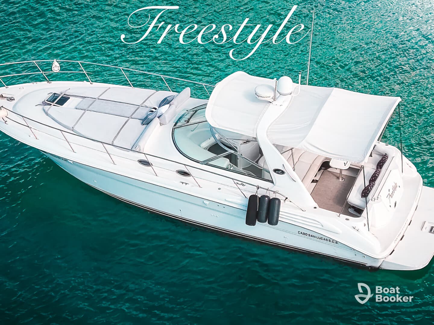A stunning aerial view of the 'Freestyle' yacht gliding through crystal-clear waters, showcasing its elegant design and inviting deck space.