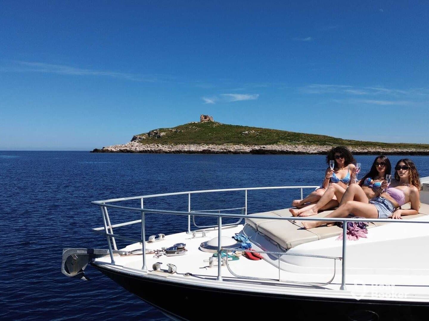 Three friends enjoy a sunny day on a yacht, sipping drinks and soaking up the sun — a perfect moment for celebration and relaxation on the water.