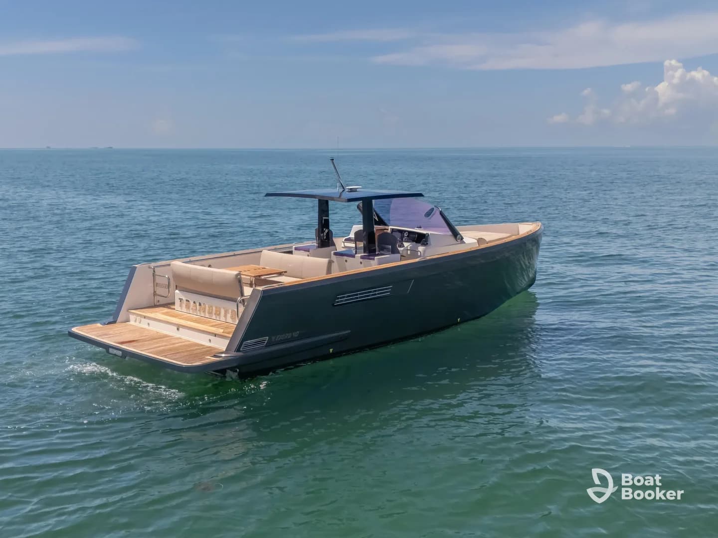 A sleek yacht glides through clear waters, showcasing its elegant design and spacious deck, perfect for luxury outings on the sea.