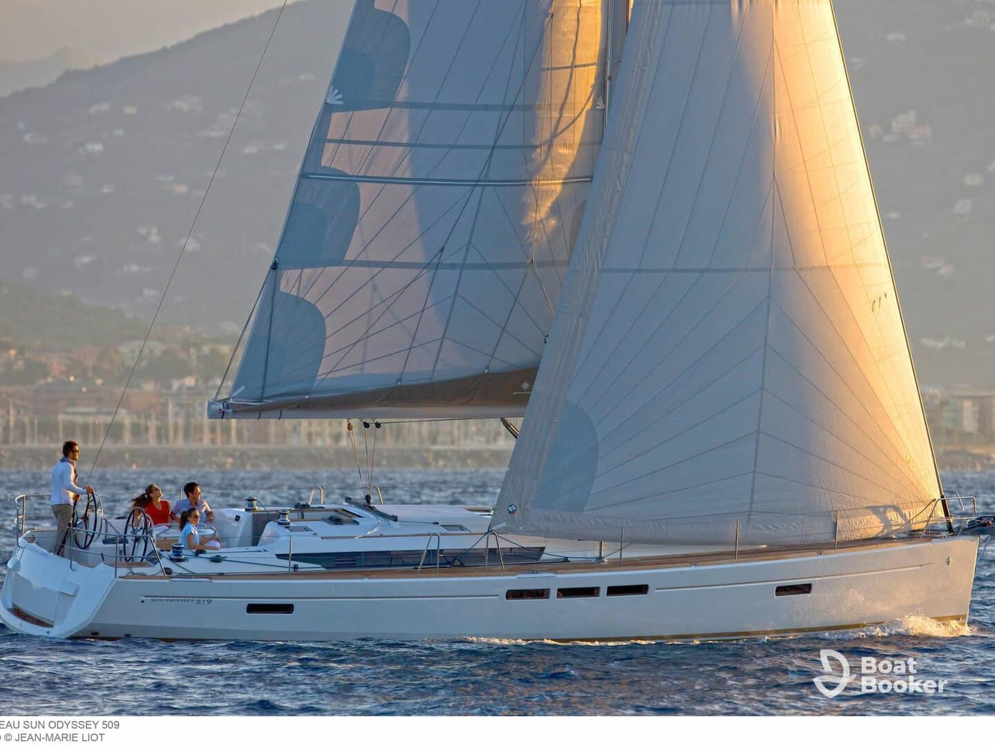 A group enjoys a sailing experience on a beautiful yacht, capturing the essence of adventure and relaxation on the water.