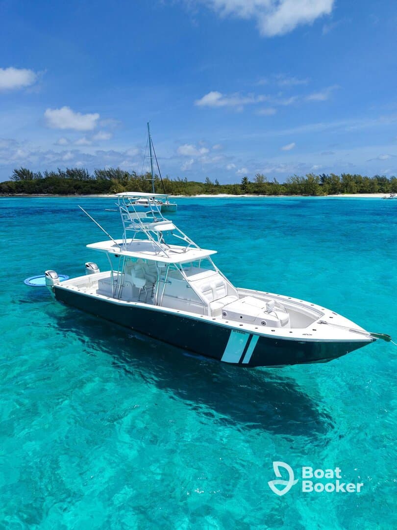 A stunning aerial view of a sleek speedboat cruising through crystal-clear turquoise waters, perfect for adventure seekers and day trips in tropical destinations.