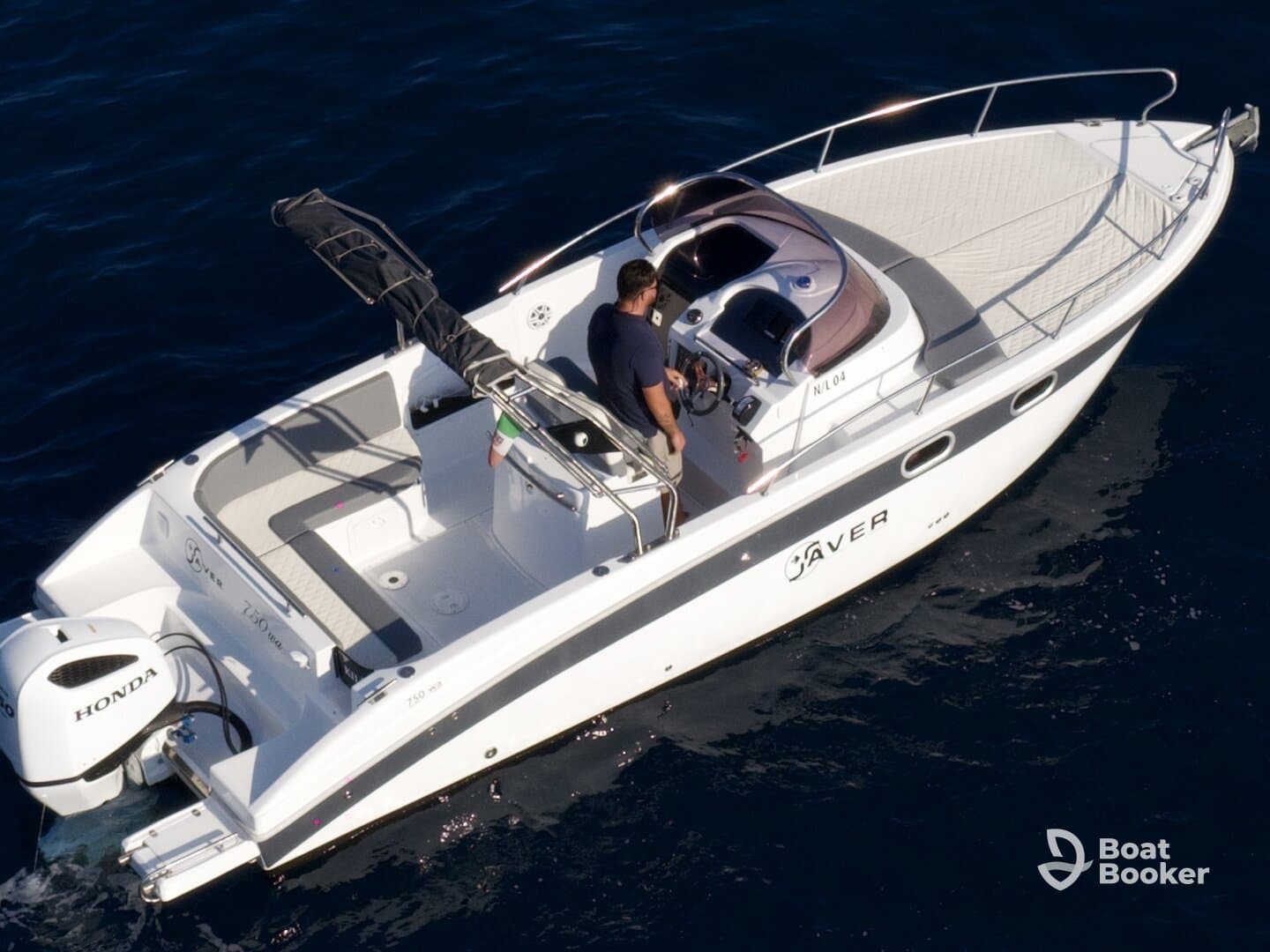 Aerial view of a sleek speedboat in motion, showcasing its elegant design and features, perfect for thrilling water adventures.