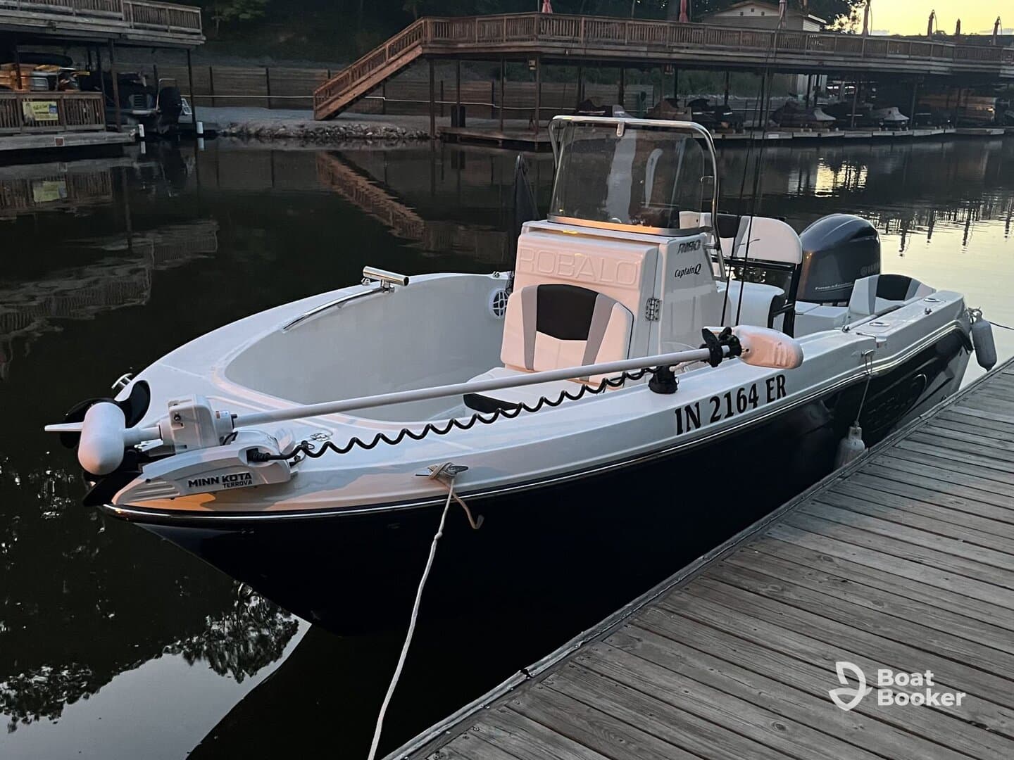 A sleek Robalo speedboat docked at a marina, showcasing its elegant design and features — perfect for a day on the water.