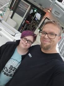 A cheerful selfie of two individuals aboard a boat, capturing a memorable moment on the water. Perfect for showcasing the joy of boating adventures.