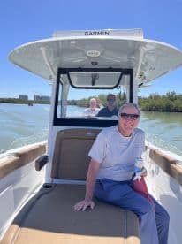 A group of friends enjoys a day on the water aboard a boat, capturing the essence of relaxation and camaraderie in a beautiful setting.