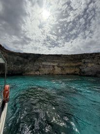 A stunning view of the coastline and crystal-clear waters, showcasing the natural beauty of the area — perfect for scenic boat tours and exploration.