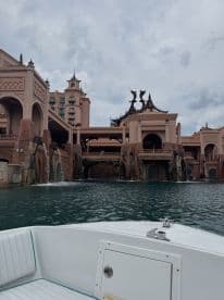 A scenic view of the iconic Atlantis resort from the water, showcasing its stunning architecture and surrounding waters — a perfect backdrop for a memorable boating experience.