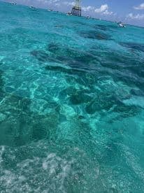 A scenic view of clear turquoise waters, but the focus is unclear and lacks identifiable subjects.
