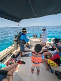 A group prepares for a snorkeling adventure on a boat, showcasing excitement and anticipation for underwater exploration.