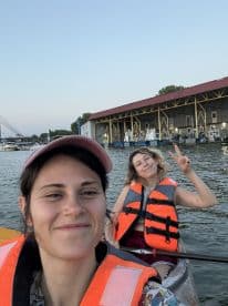 Two friends enjoy a fun kayaking adventure, showcasing the joy of outdoor water activities. Perfect for those seeking memorable experiences on the water.