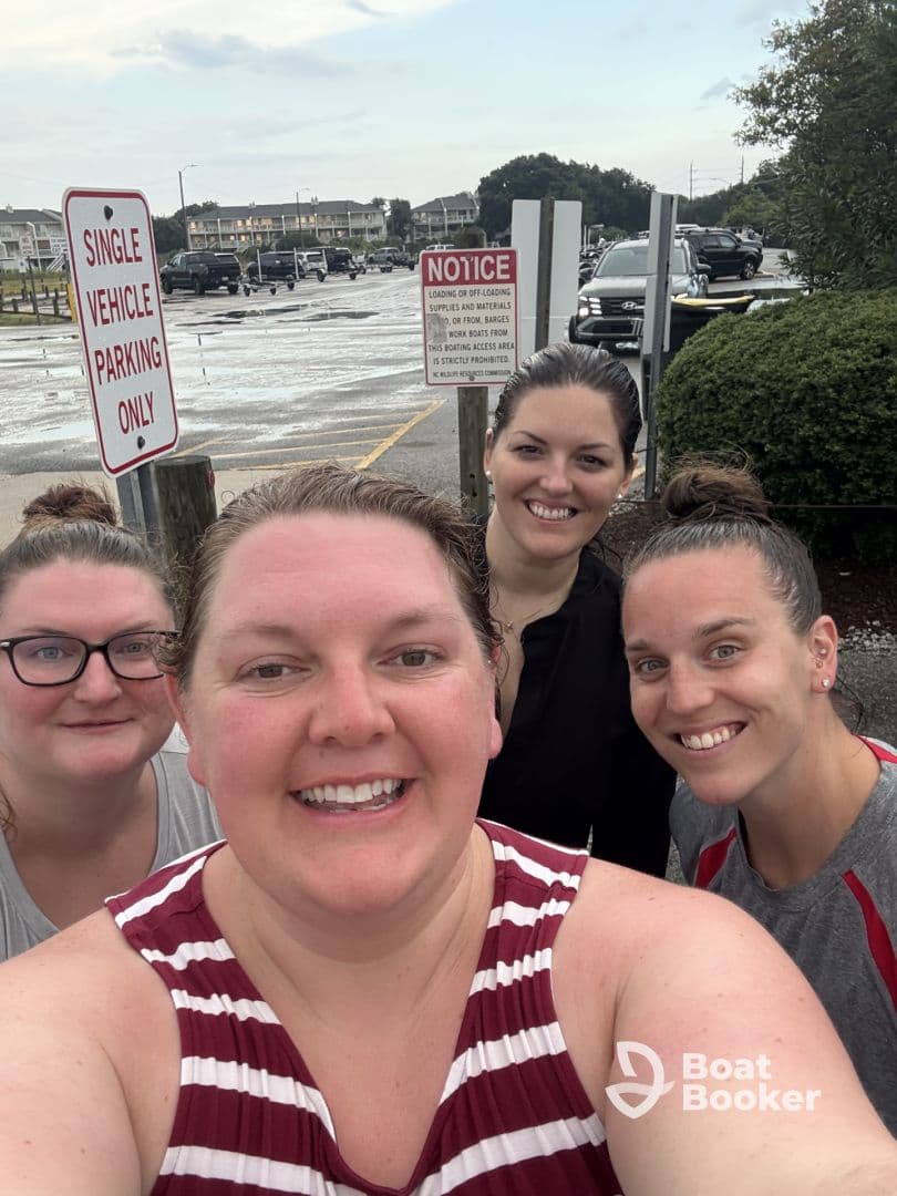A cheerful group of friends poses for a selfie, capturing a fun moment before their boating adventure. Perfect for showcasing camaraderie and excitement for a day on the water.