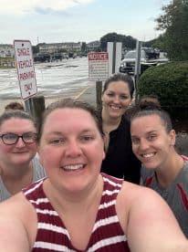 A cheerful group of friends poses for a selfie, capturing a fun moment before their boating adventure. Perfect for showcasing camaraderie and excitement for a day on the water.