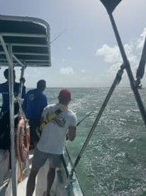A group of anglers enjoys a fishing trip on the open water, showcasing the excitement of on-water activities and camaraderie.