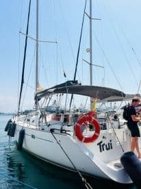 A sleek yacht named 'Trui' docked at the marina, showcasing its elegant design and ready for the next adventure on the water.
