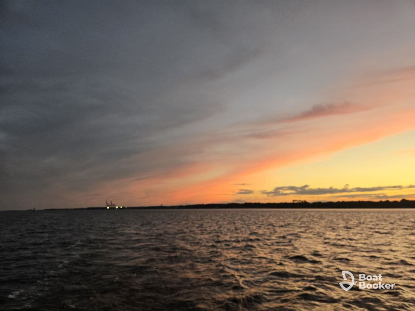 A stunning sunset over tranquil waters, showcasing the beauty of nature and the perfect backdrop for a peaceful boating experience.