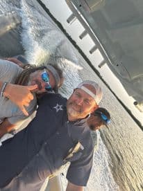 A group of friends enjoys a fun day on the water, capturing the excitement of boating with smiles and camaraderie.