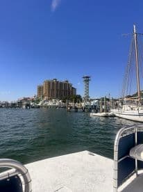 A scenic view from a boat at the marina, showcasing the waterfront and nearby buildings, perfect for those looking to explore local attractions.