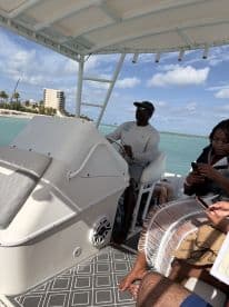 Guests enjoy a scenic boat ride with a captain at the helm, capturing the essence of a fun day on the water.