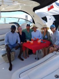 A lively group enjoys cocktails on a boat, perfect for celebrations and social gatherings on the water.