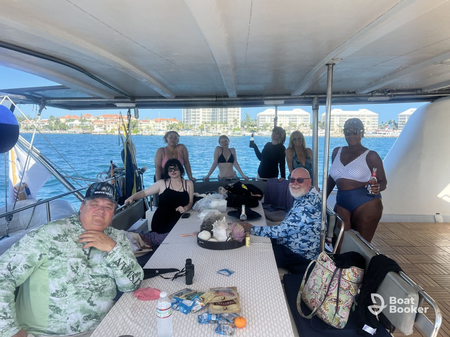 A lively group enjoys drinks and camaraderie aboard a boat, perfect for celebrations and memorable outings on the water.