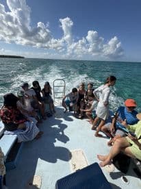 A lively group enjoys a boat ride, capturing the essence of adventure on the water with friends and family.
