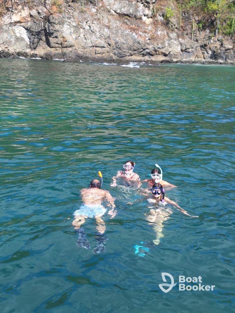 A group of snorkelers enjoys a vibrant underwater adventure in clear waters, perfect for exploring marine life and creating unforgettable memories.