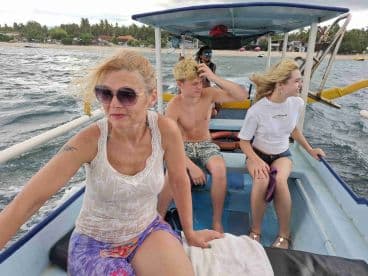A group of friends enjoys a boat ride, capturing the thrill of adventure on the water. Perfect for showcasing fun experiences and group outings.