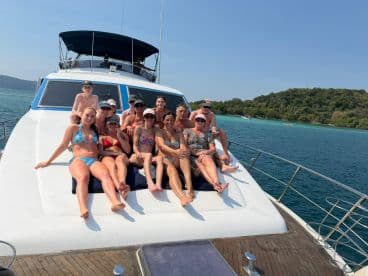 A lively group enjoys a day on the boat, soaking up the sun and celebrating together — perfect for memorable outings and gatherings on the water.