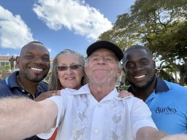 A cheerful group poses for a selfie, capturing a joyful moment together — perfect for celebrating friendships and memorable experiences.