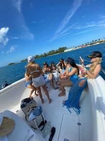 A lively group of friends enjoys a fun day on the boat, capturing memories under the sun — perfect for celebrations and gatherings on the water.