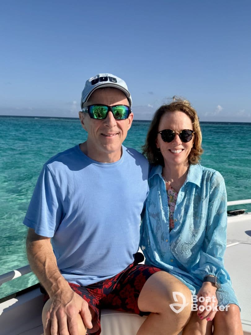 A happy couple enjoys their time on a boat, surrounded by stunning ocean views — perfect for romantic getaways or special celebrations.
