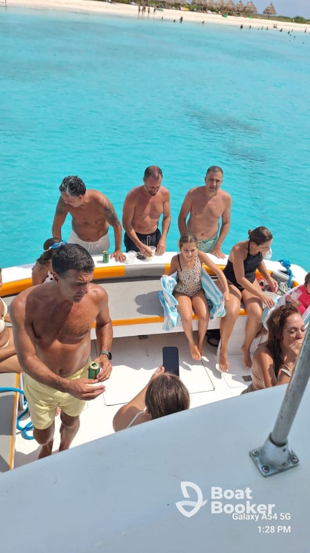 A lively group enjoys a fun day on the water, relaxing on a boat with drinks and laughter, perfect for summer outings and family adventures.