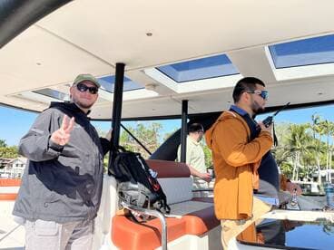 A group of friends enjoys their time aboard a boat, capturing a moment of camaraderie and fun in the sun.