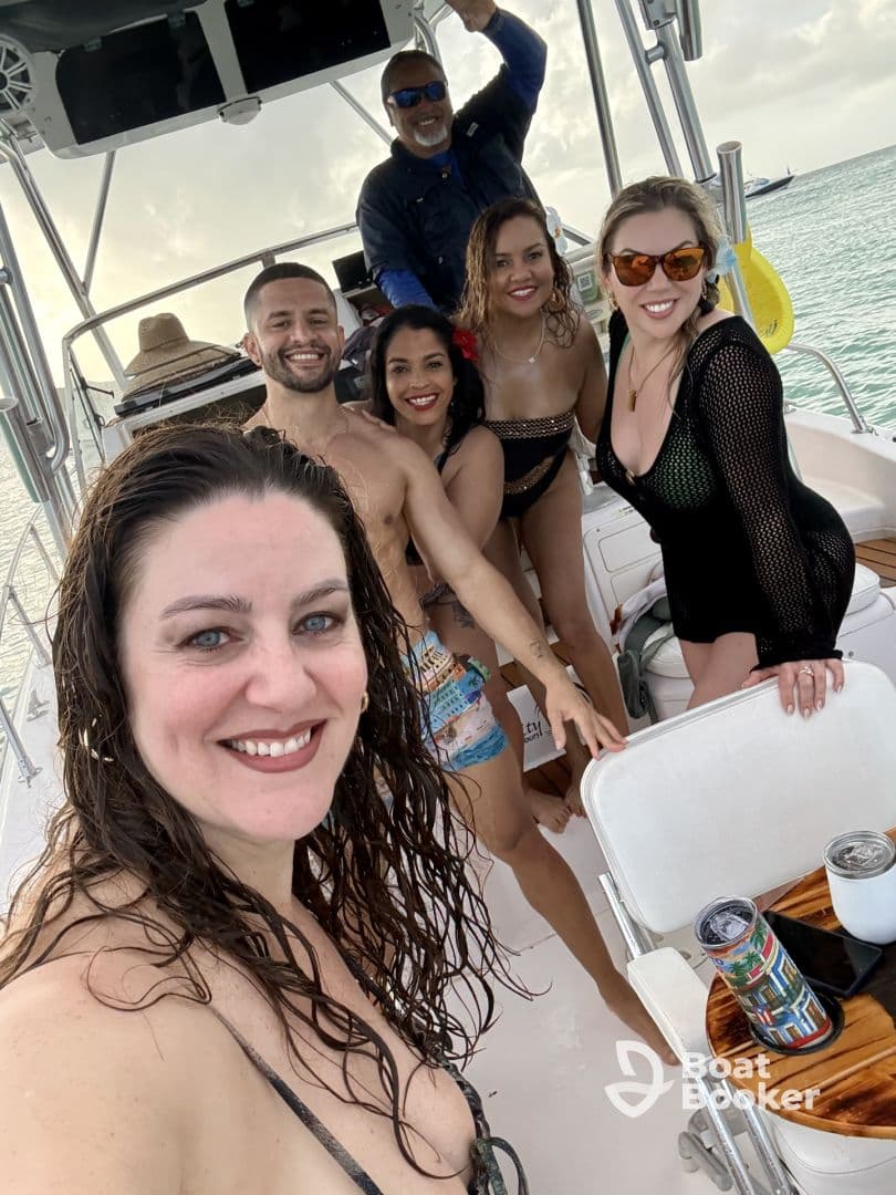 A lively group of friends enjoys a fun day on the boat, capturing memories with smiles and laughter — perfect for celebrations and adventures on the water.
