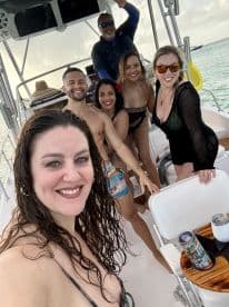 A lively group of friends enjoys a fun day on the boat, capturing memories with smiles and laughter — perfect for celebrations and adventures on the water.