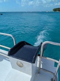 A close-up view of the helm area on a boat, showcasing the console and surrounding features — perfect for those interested in boat interiors and navigation.