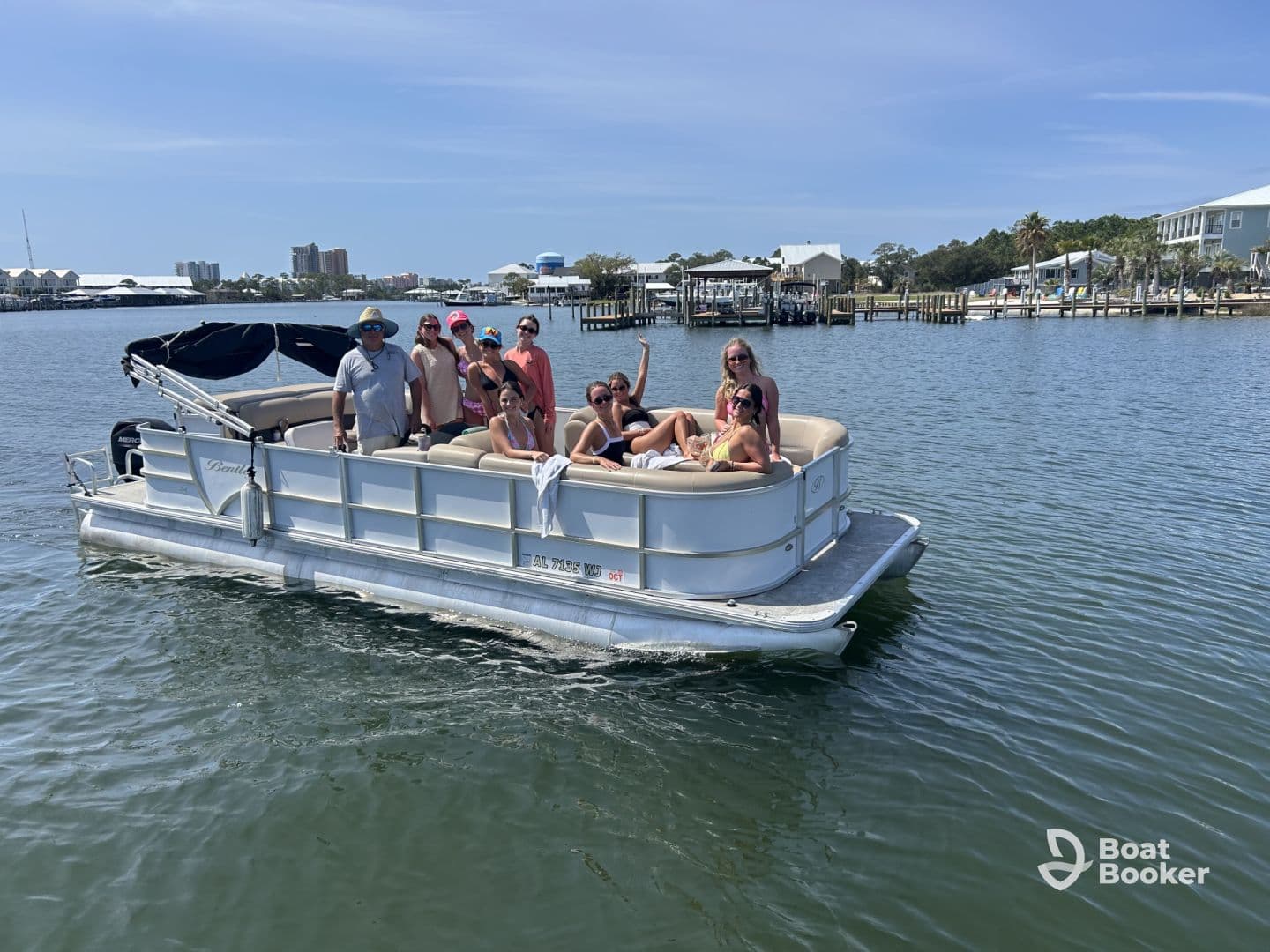 A lively group enjoys a day on a pontoon boat, celebrating and having fun on the water — perfect for summer outings and gatherings.