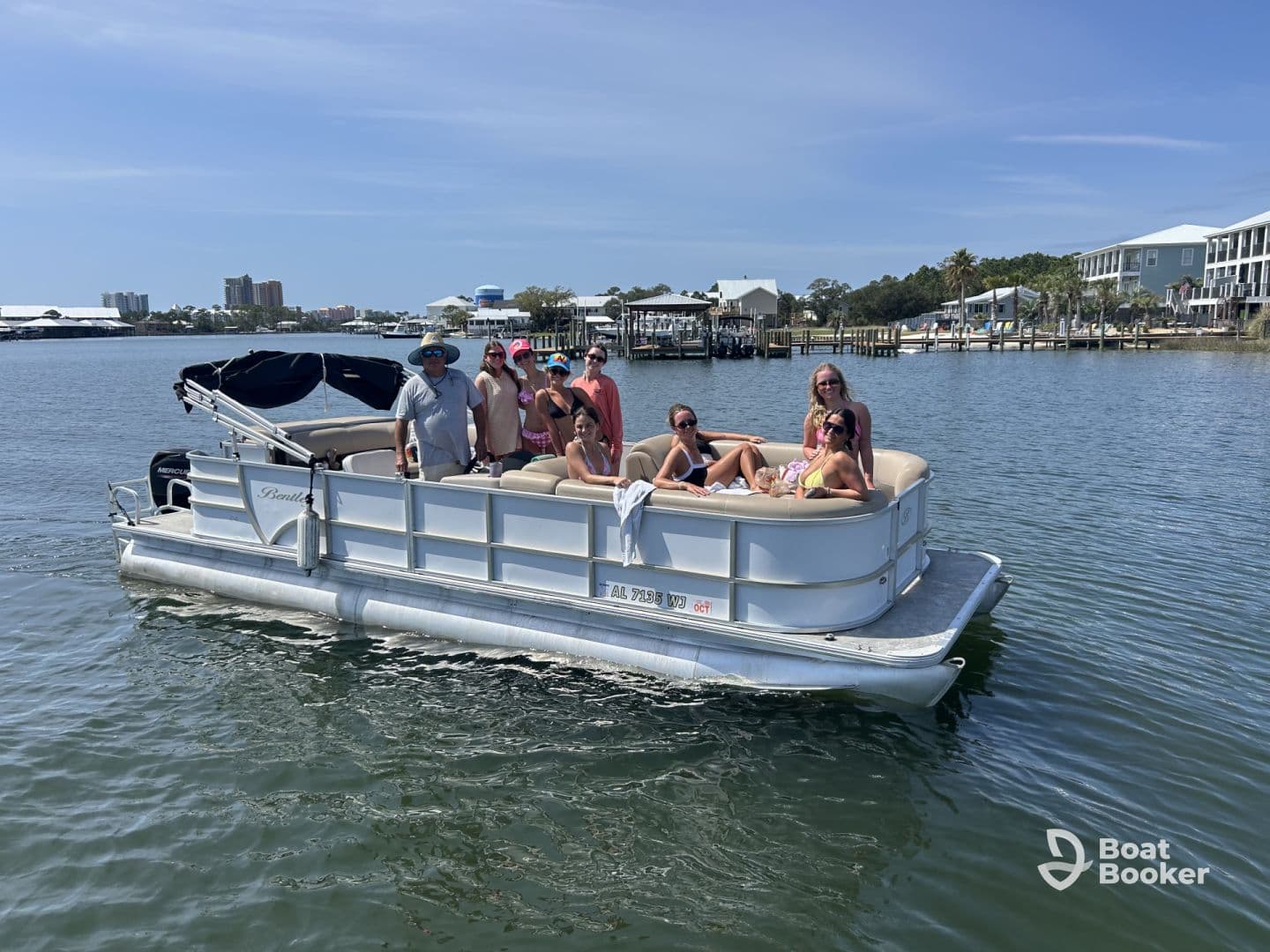 A lively group enjoys a day on a pontoon boat, perfect for summer fun and gatherings on the water.