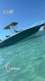 A sleek speedboat named 'Blue Heaven' captured in clear turquoise waters, perfect for a day of adventure on the sea.