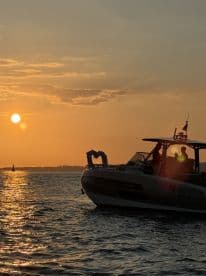 A beautiful sunset view featuring a decorated boat, perfect for romantic celebrations on the water.