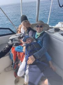 A joyful family enjoys their time on a boat, showcasing togetherness and fun on the water.