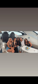 A fun group of friends enjoys a celebration aboard a boat, showcasing the perfect atmosphere for memorable gatherings on the water.