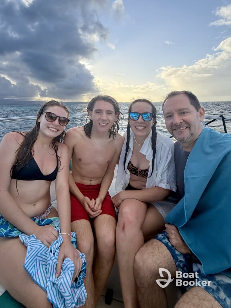 A cheerful group of friends enjoys a sunny day on the water, capturing memories with smiles and laughter — perfect for summer adventures and celebrations.